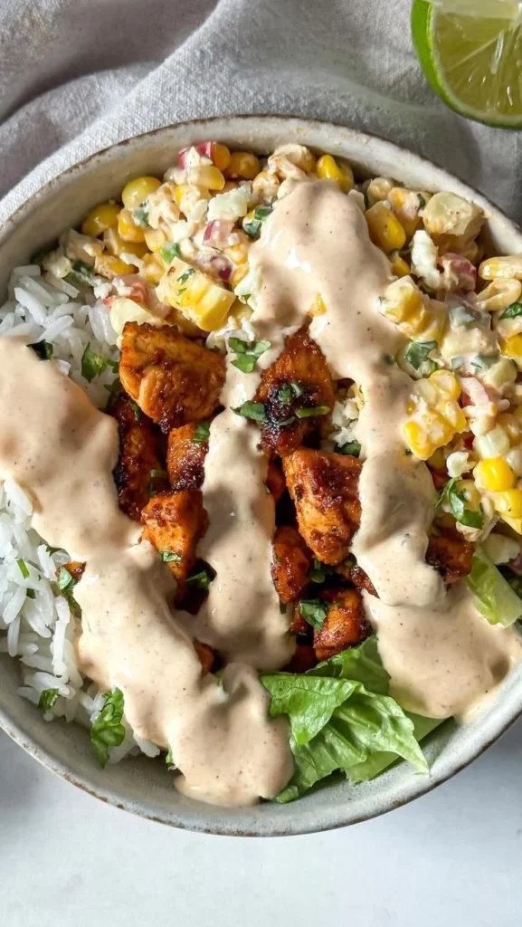 Delicious street corn chicken rice bowls with vibrant toppings