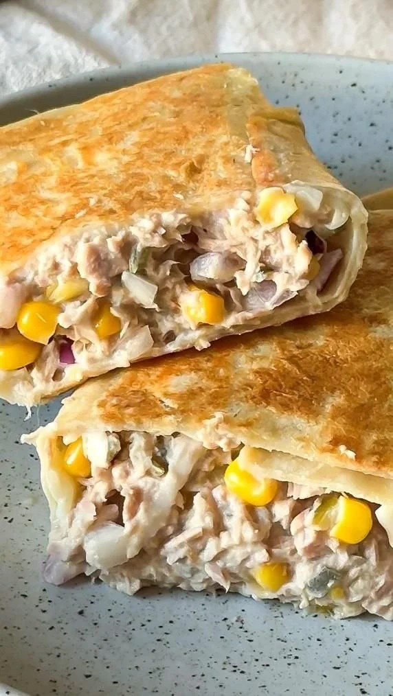 Delicious Tuna Melt Wrap on a plate with fresh ingredients